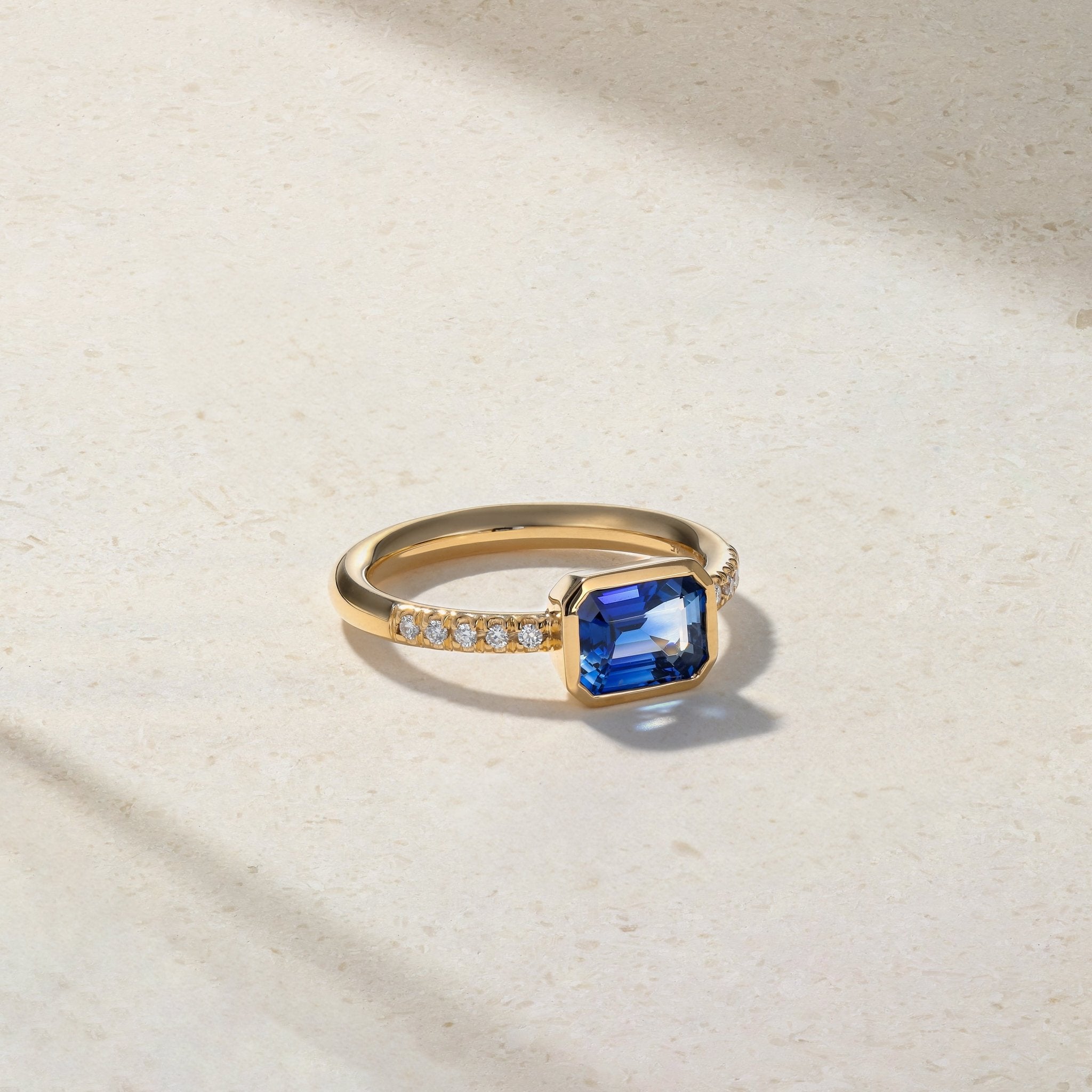 East-West Emerald Cut Sapphire and Diamond Bezel Ring