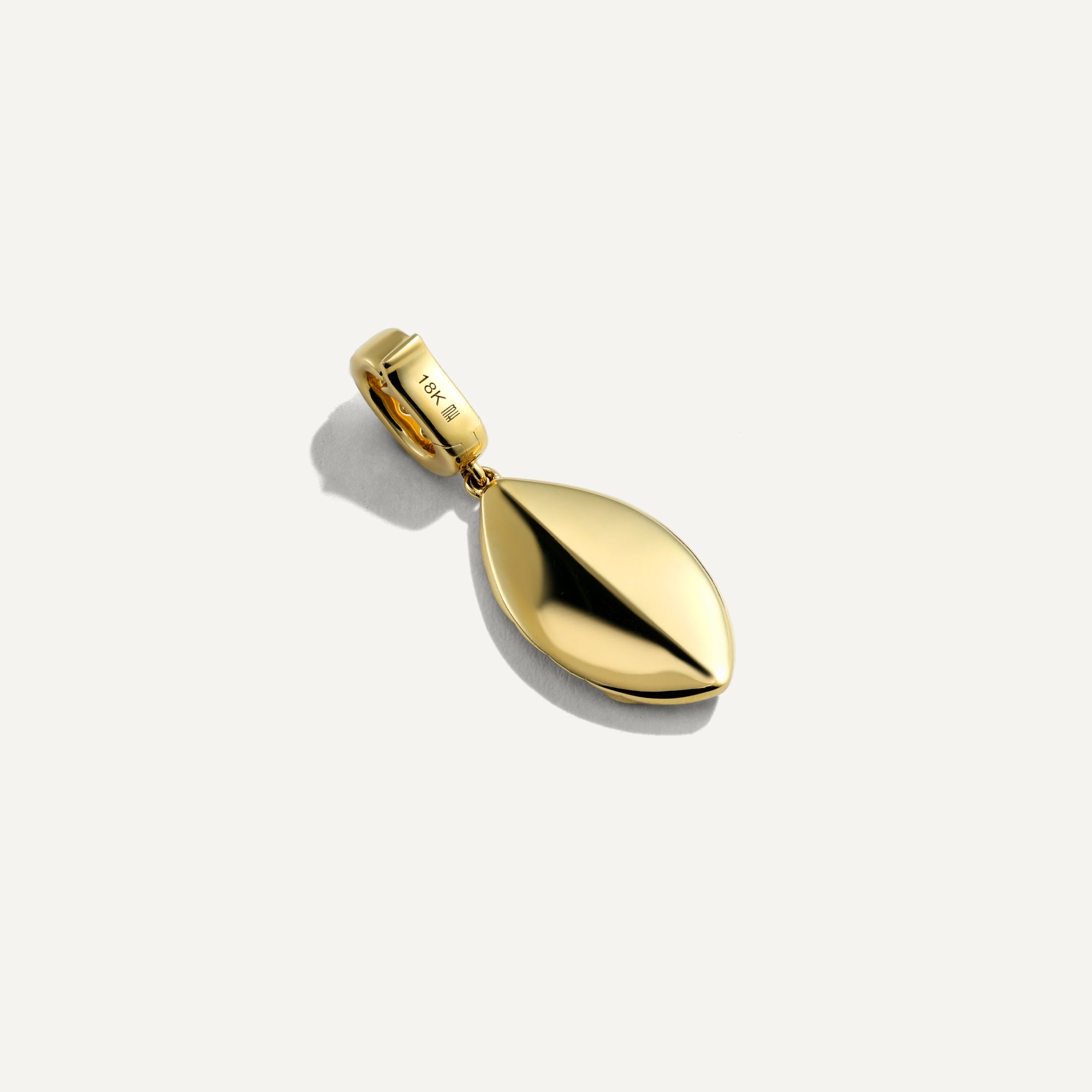 Gold pendant on a white background