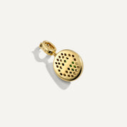 Gold charm with a textured design on a white background